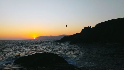 Scenic view of sea against sky during sunset