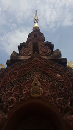 Low angle view of ornate building against sky