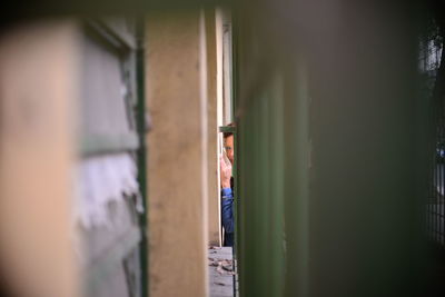 Portrait of woman seen through walls