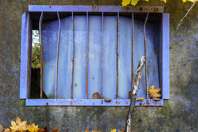 Close-up of weathered window on wall