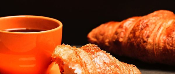 Close-up of orange juice against black background