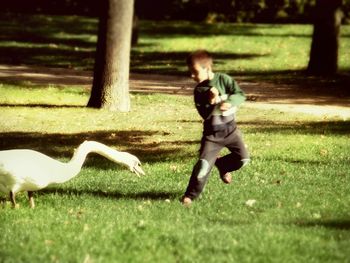 Man running on grassy field