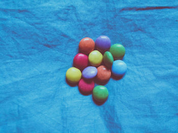 High angle view of colorful balls on blue water