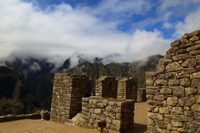 View of old ruins against cloudy sky