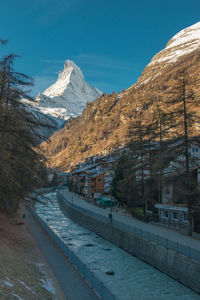 Scenic view of snowcapped mountains against clear sky