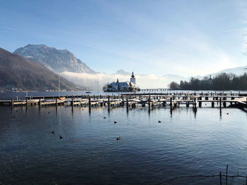 Scenic view of lake against sky during winter