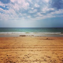 Scenic view of beach against sky