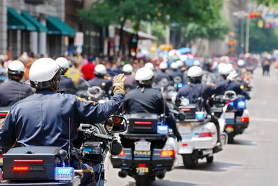 Rear view of people on city street