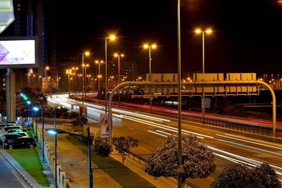 Light trails on road in city at night