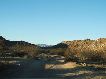 Scenic view of landscape against clear blue sky