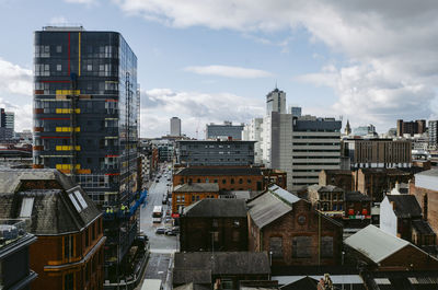 High angle view of buildings in city against sky