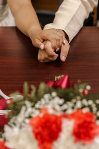 Cropped hand of woman preparing food on table