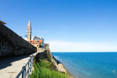 Scenic view of sea against clear blue sky