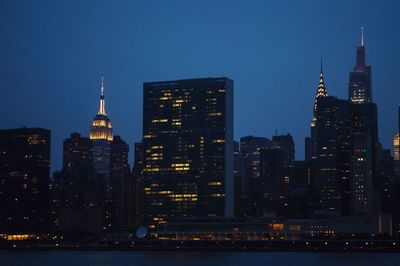 Illuminated buildings in city at night