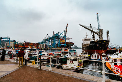 Boats moored at harbor