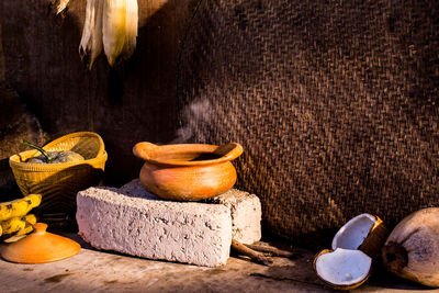 Close-up of food on table against wall