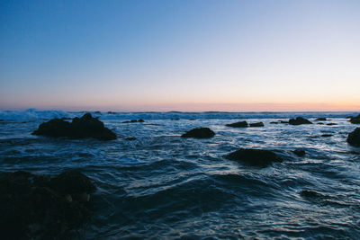 Scenic view of sea at sunset