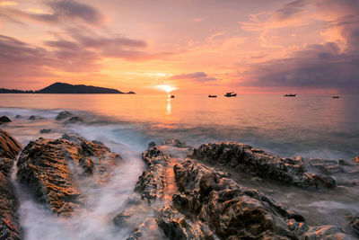 Scenic view of sea against sky during sunset