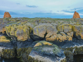 Scenic view of rock formations against sky