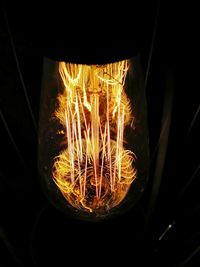 Close-up of illuminated fire in the dark