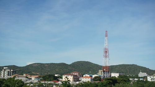 Tower amidst buildings against sky in city