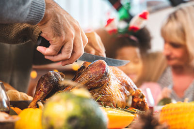 Close-up of man preparing food