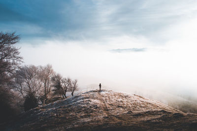 Low angle view of snowcapped landscape against sky