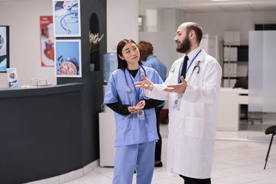 Portrait of female doctor standing in hospital