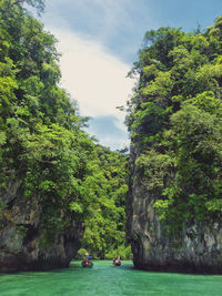 Scenic view of boat in sea against sky