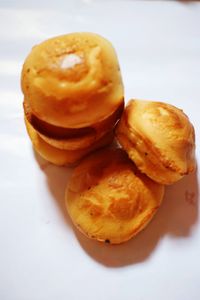 Close-up of burger against white background