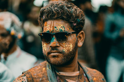 Close-up portrait of young man wearing sunglasses