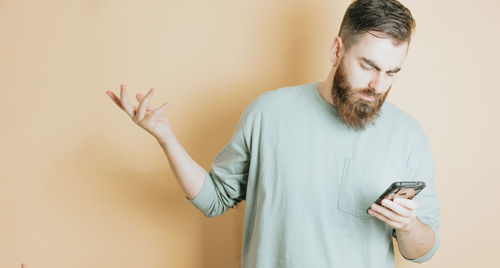 Young man using mobile phone