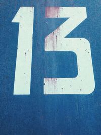 Number 13 painted on wall