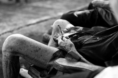 Close-up of person holding stick