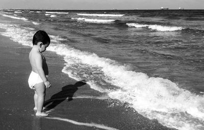 Waves splashing on rocks at sea shore