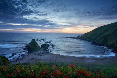 Scenic view of sea against sky during sunset