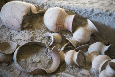 Broken clay pots on ground
