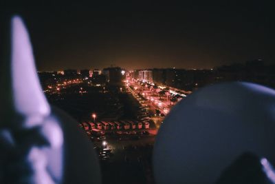 High angle view of illuminated buildings in city at night