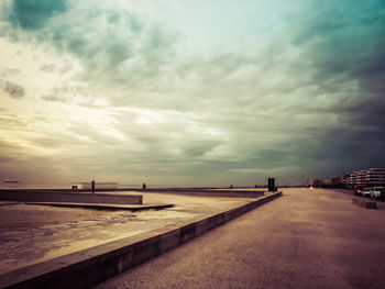 Scenic view of beach against sky during sunset