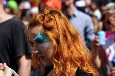 Close-up portrait of young woman in park