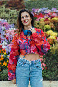 Portrait of smiling young woman standing outdoors
