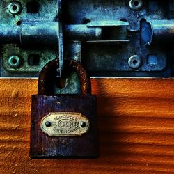 Close-up of padlocks hanging on metal