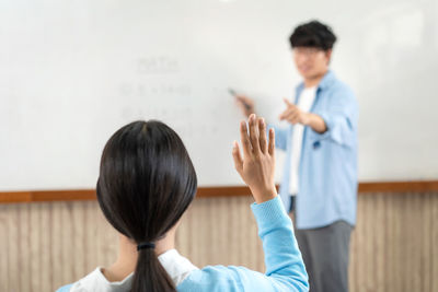 Side view of doctor examining patient in office