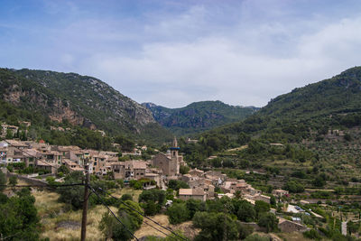 High angle view of town against cloudy sky