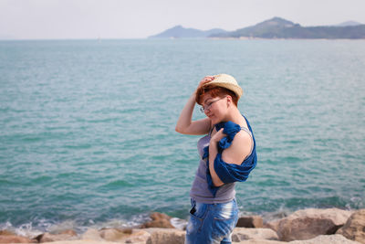 Full length of man standing on beach