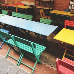 Close-up of chairs on table