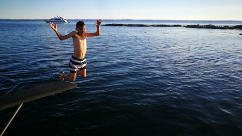 Boy diving in sea