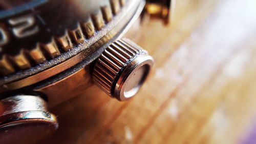 Cropped image of watch on table