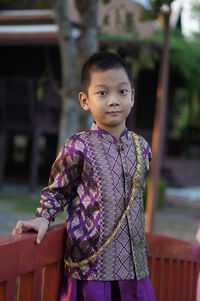 Portrait of cute girl standing outdoors