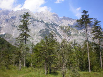 Scenic view of mountains against cloudy sky